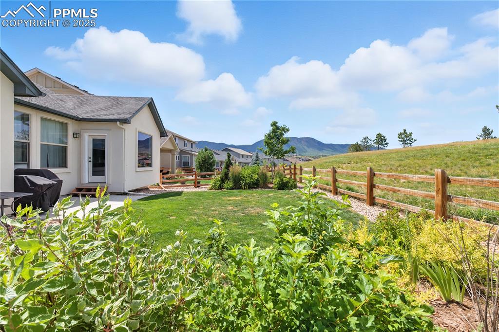 Image 34 of 40: View of fenced backyard