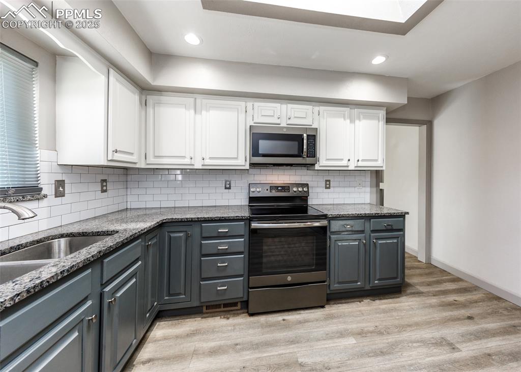 Image 11 of 50: Another View of Kitchen