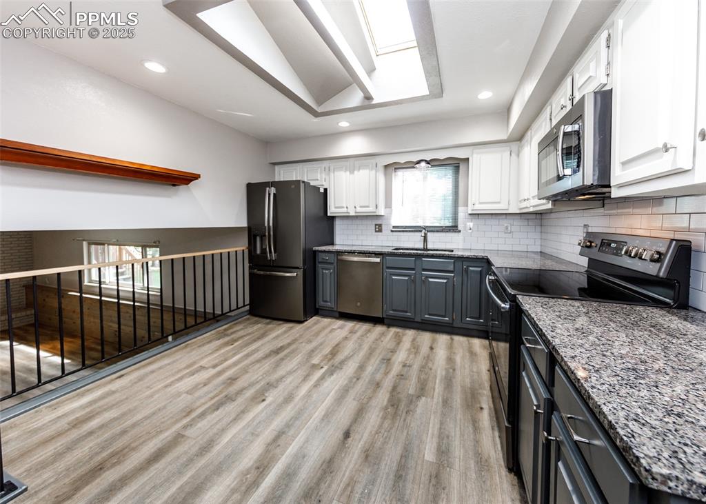 Image 13 of 50: Another View of Kitchen