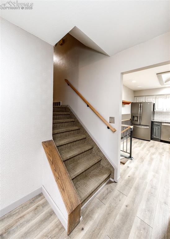 Image 15 of 50: Stairs to Upper Level.