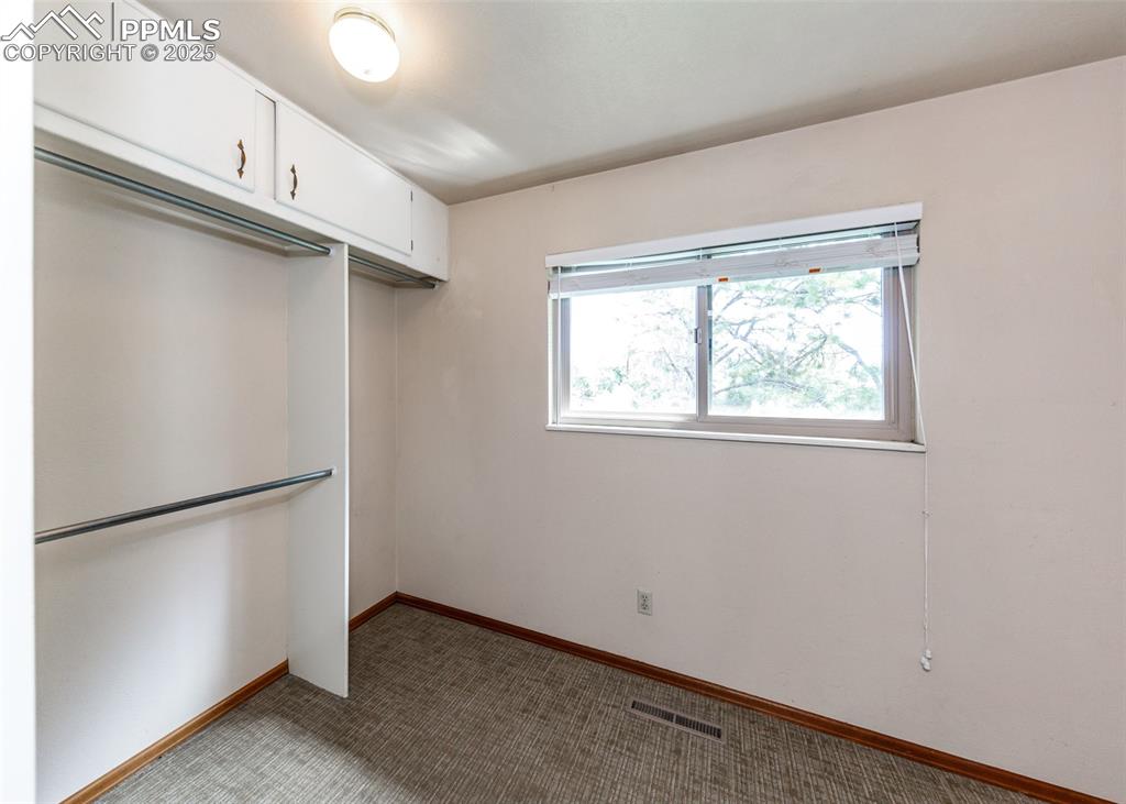 Image 18 of 50: Primary Bedroom Walk-in Closet