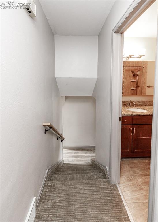 Image 25 of 50: Stairway from Upper Level to Main Level