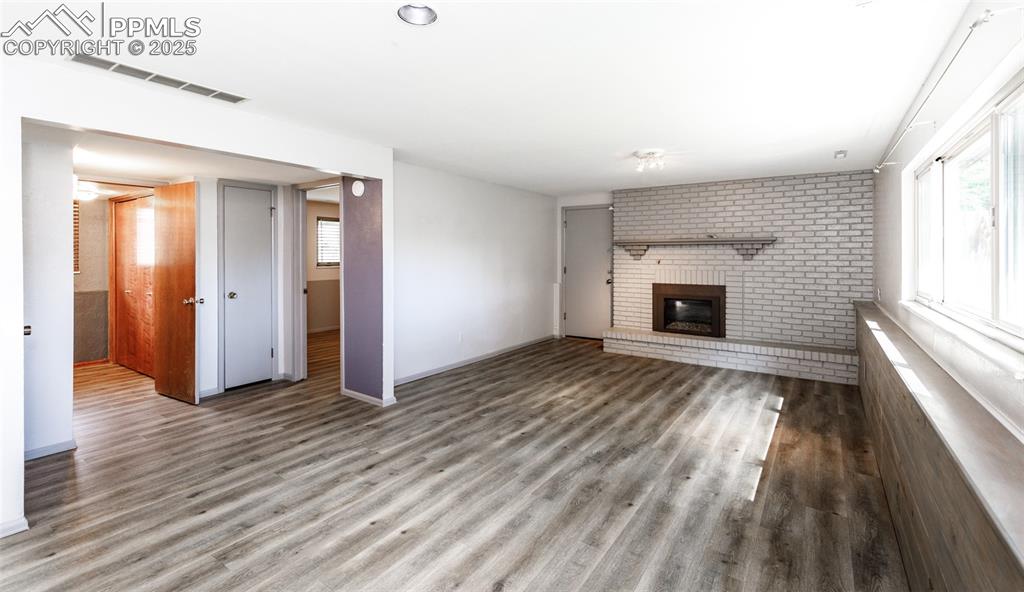 Image 27 of 50: Gas Log Fireplace with Hearth in Family Room