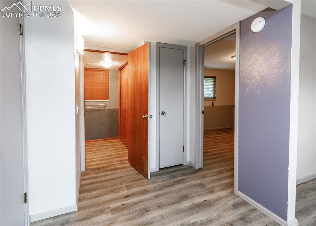 Image 29 of 50: View from Family Room to Bedroom #3 and 3/4 Bath/Laundry