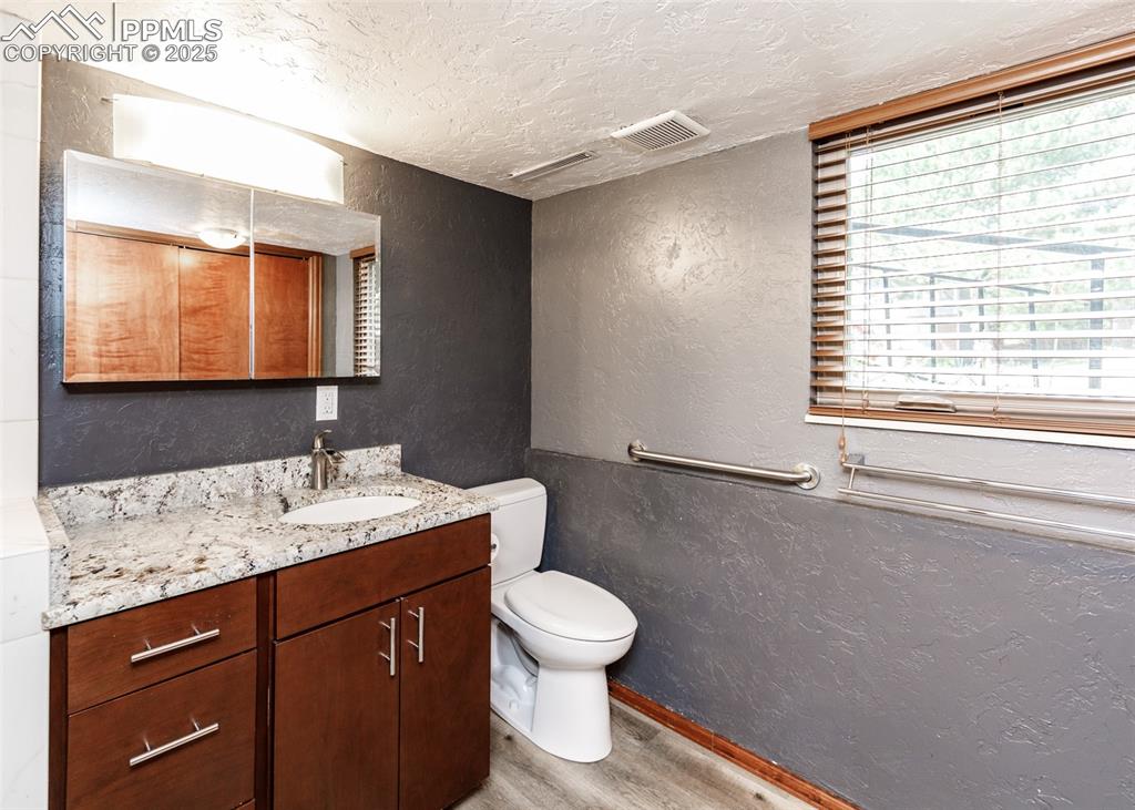 Image 32 of 50: 3/4 Bathroom/Laundry Room on Lower Level