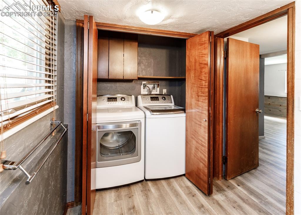 Image 34 of 50: Laundry Closet in 3/4 Bath on Lower Level. Washer & Dryer Stay.