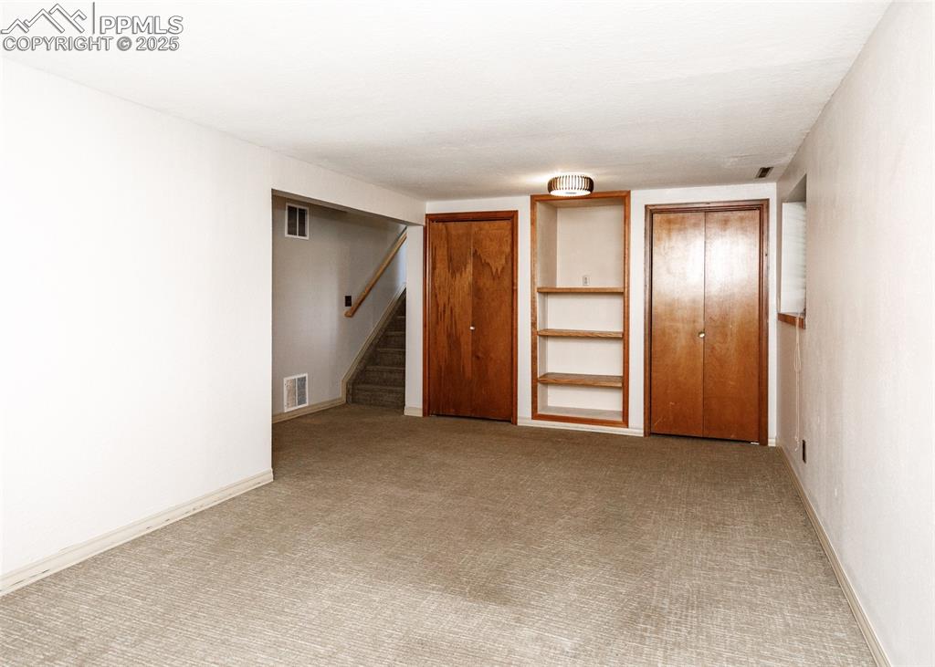 Image 36 of 50: Another View of Large Bedroom in Basement