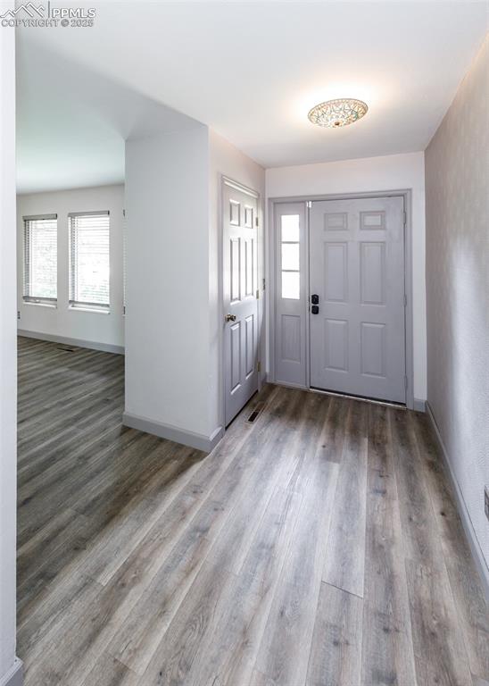 Image 4 of 50: Entry with Luxury Vinyl Plank Flooring and Entry Closet