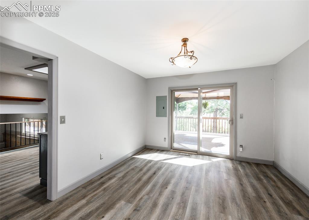 Image 9 of 50: Walkout from Dining Room to Deck