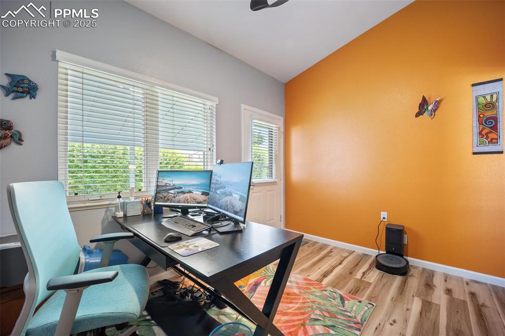 Image 20 of 50: Office space featuring wood finished floors and baseboards