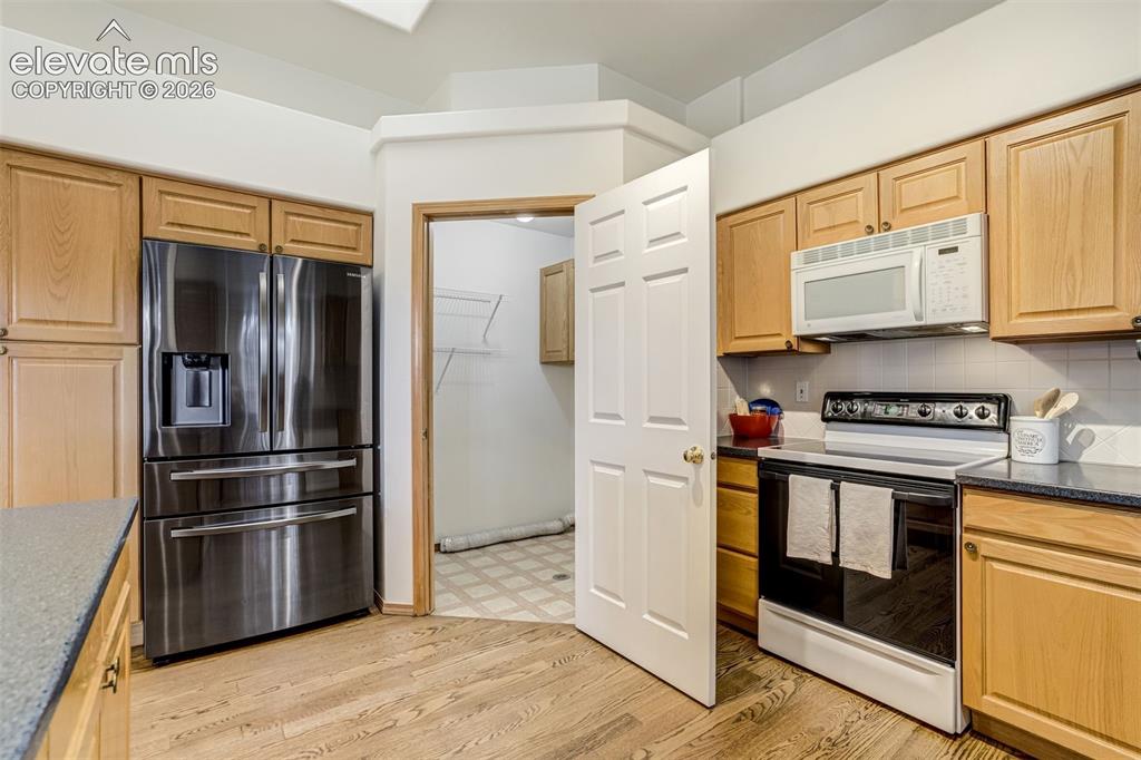 Image 19 of 50: Laundry room off of the kitchen- main floor