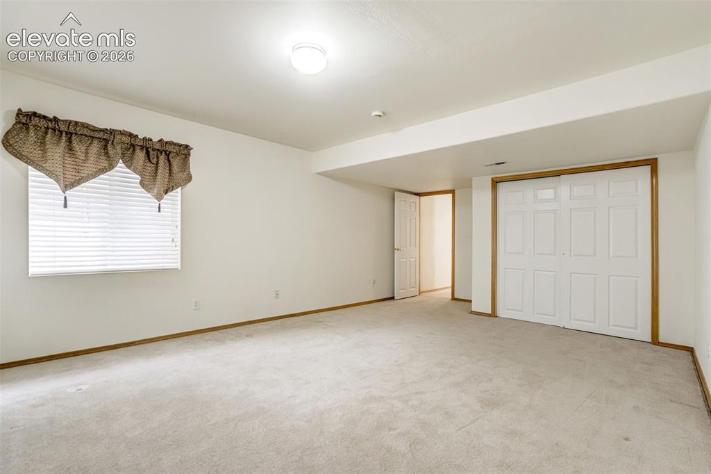 Image 38 of 50: Basement second bedroom