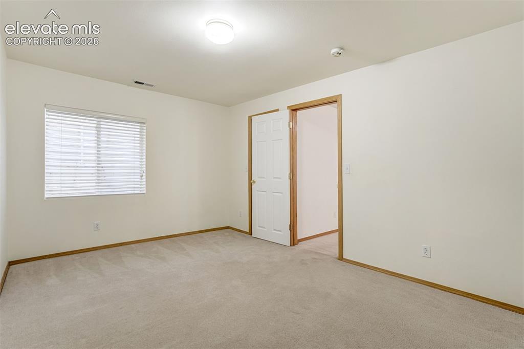 Image 42 of 50: Basement third bedroom