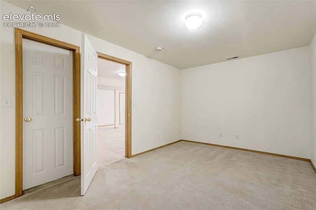 Image 43 of 50: Basement third bedroom