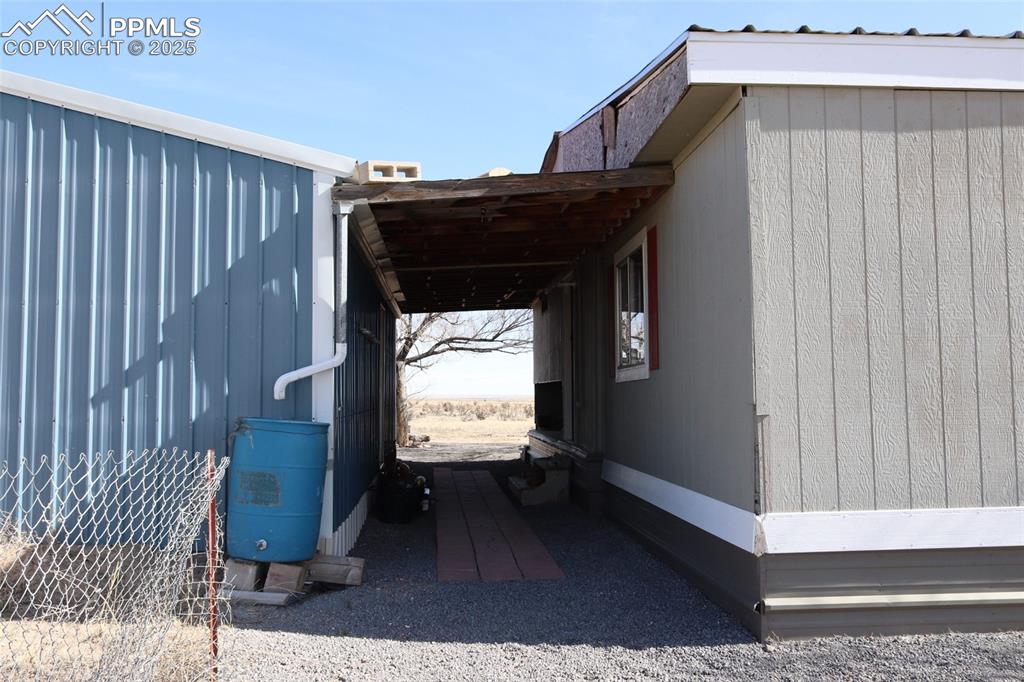Image 16 of 29: Covered walkway between structures