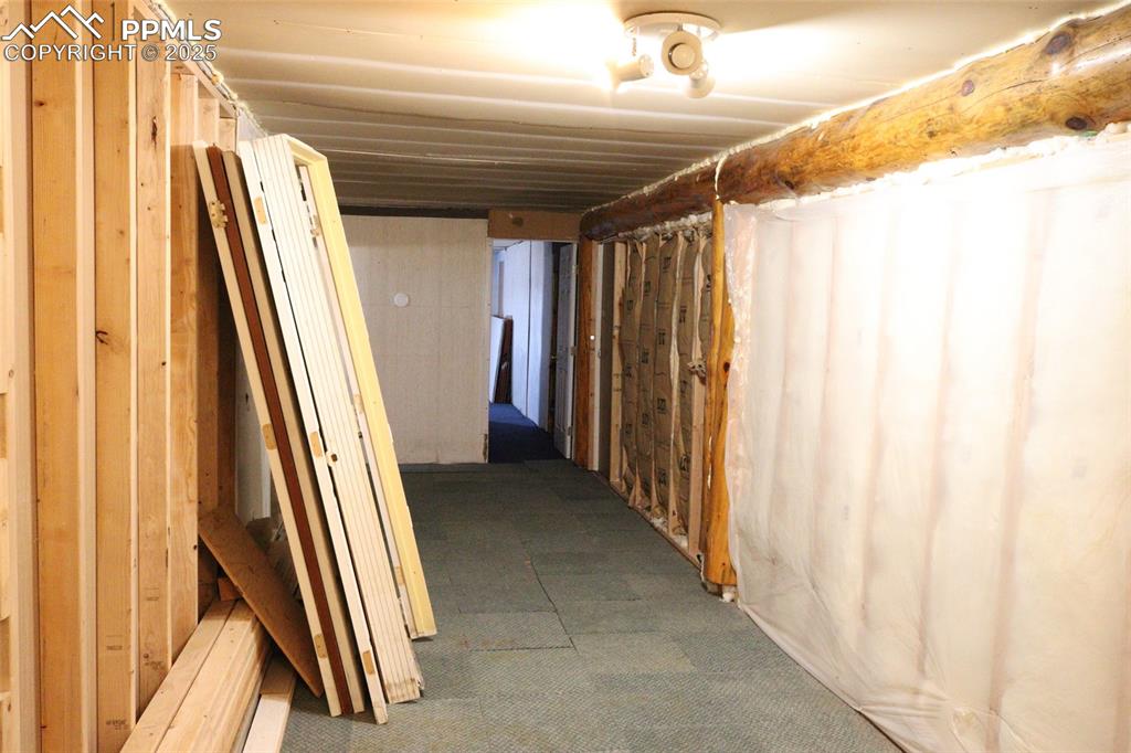 Image 19 of 29: hall way wall separating two homes