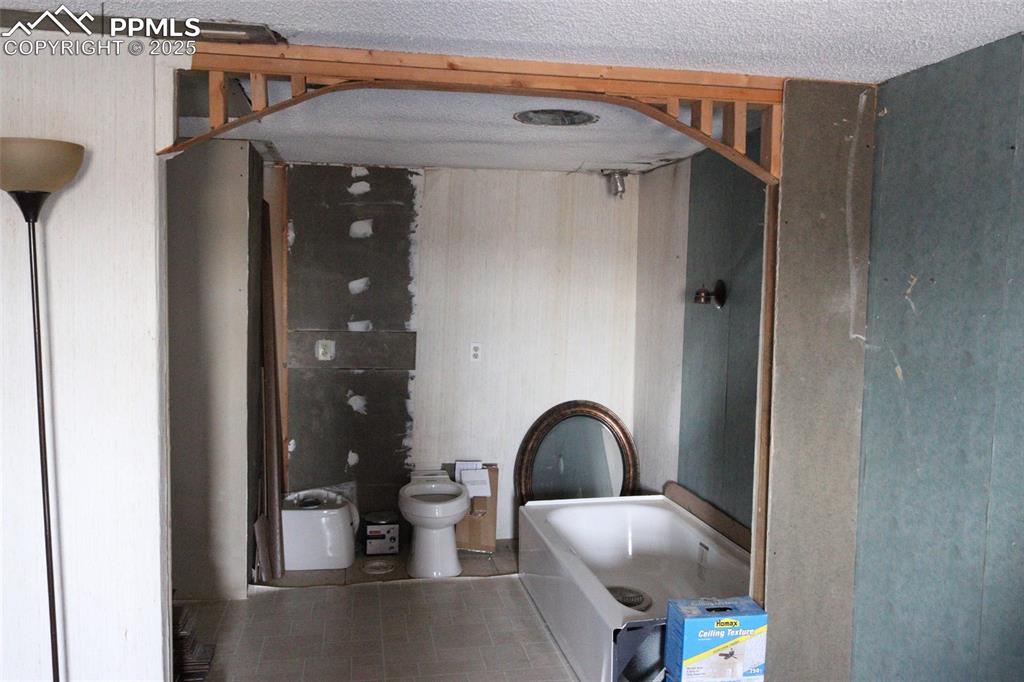 Image 24 of 29: North side home Main bedroom area attached bath area