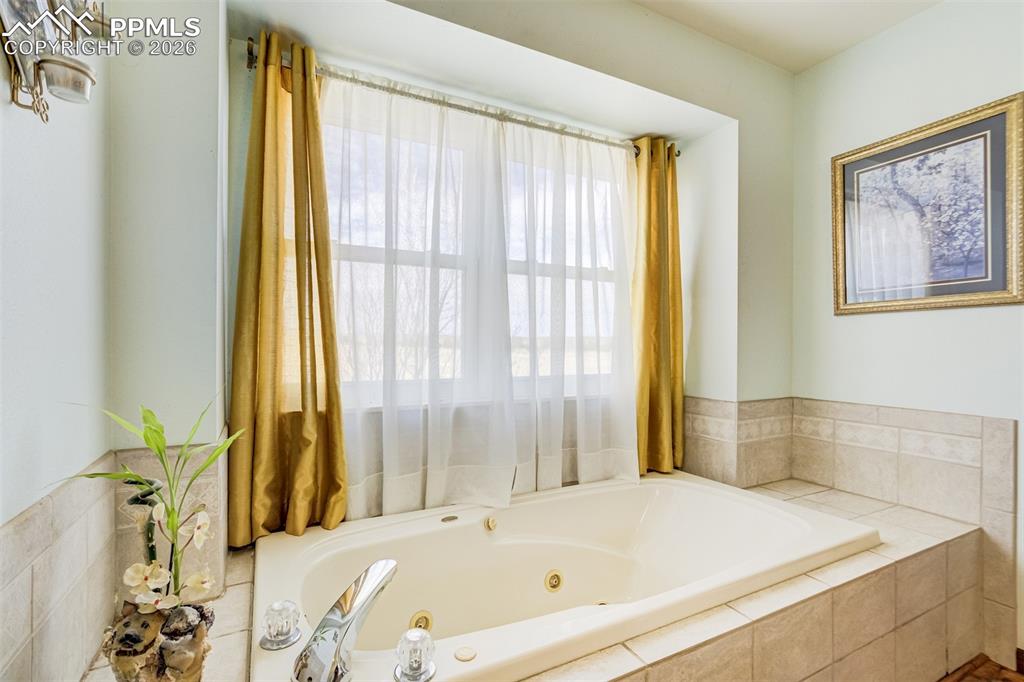 Image 11 of 44: Primary bath.