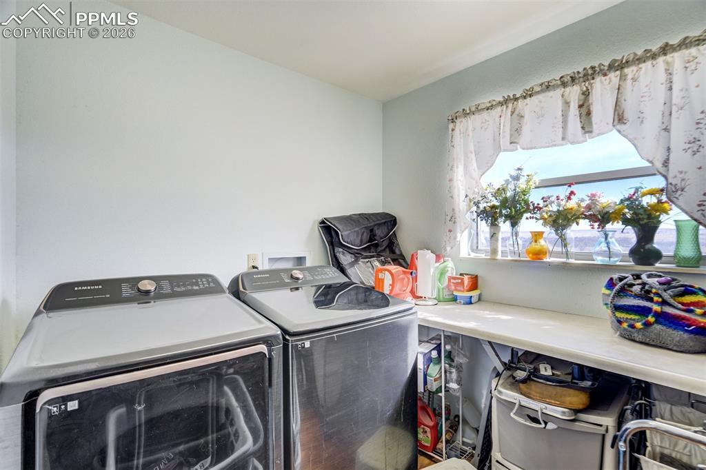 Image 19 of 44: Main level laundry room.