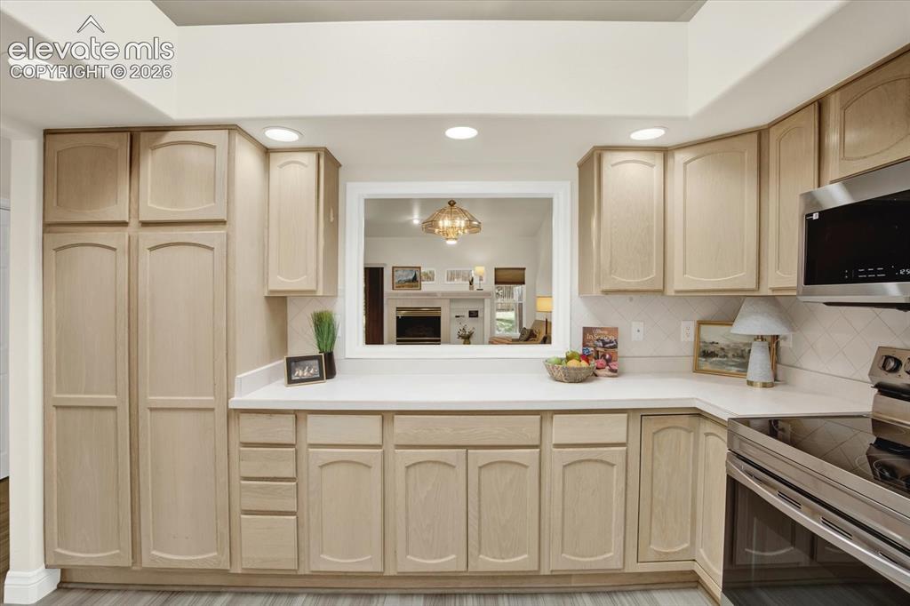 Image 3 of 46: Pass through from the kitchen to thee dining area.