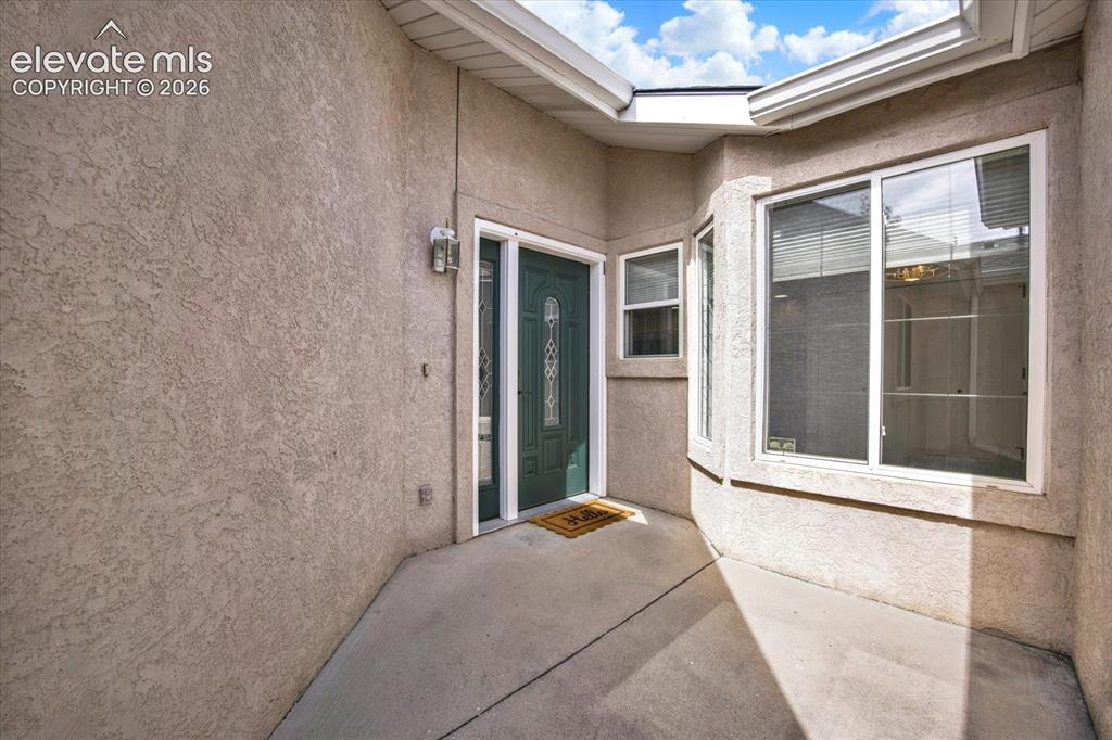 Image 46 of 46: Gated courtyard entry.