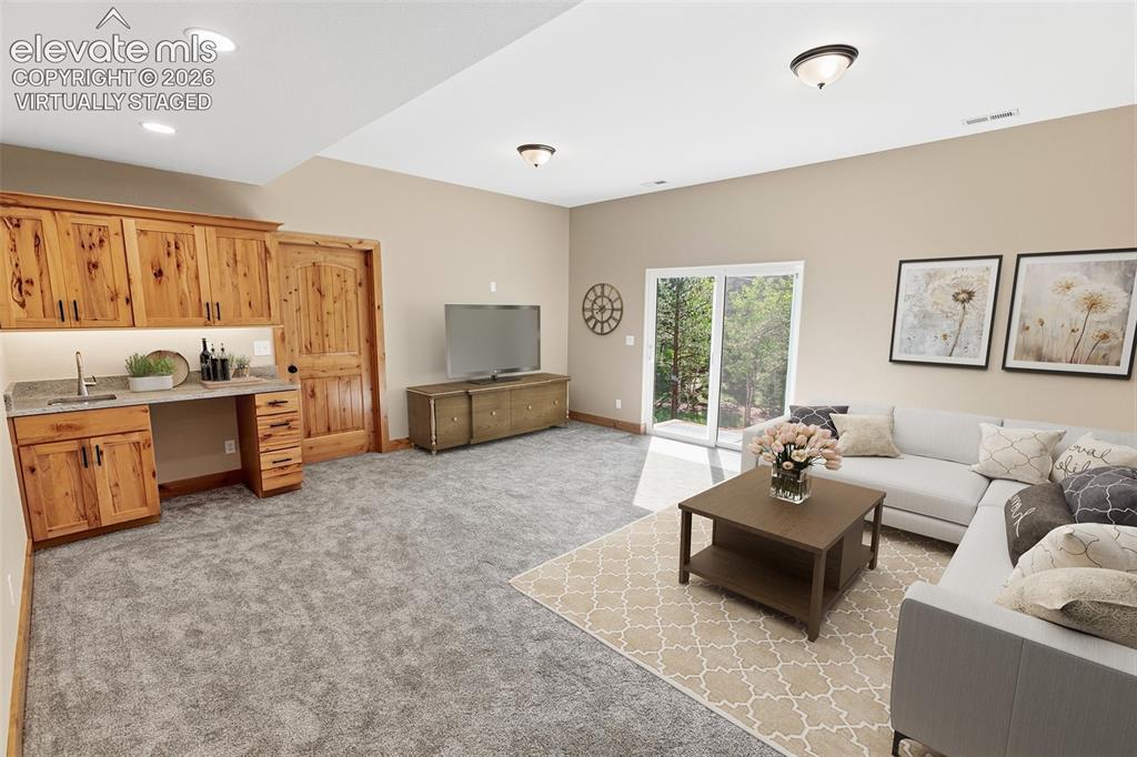 Image 15 of 37: Lower Level Family Room - Virtually Staged