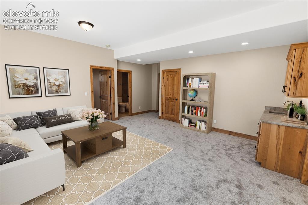 Image 16 of 37: Lower Level Family Room - Virtually Staged