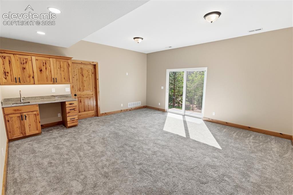 Image 31 of 37: Lower Level Family Room