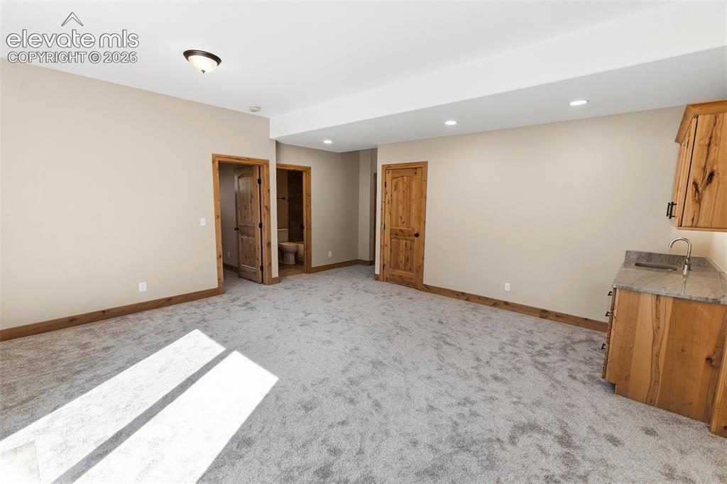 Image 32 of 37: Lower Level Family Room