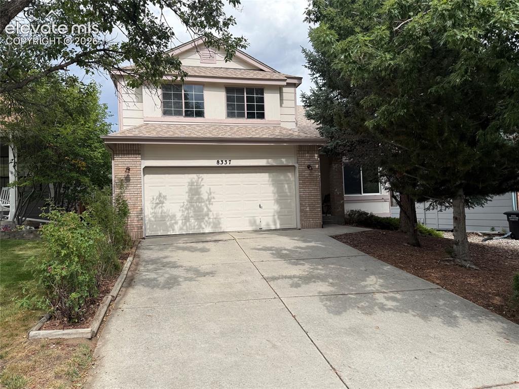 Caption: Well maintained home with 2 car garage. Mature trees, easy to maintain landscaping and covered front