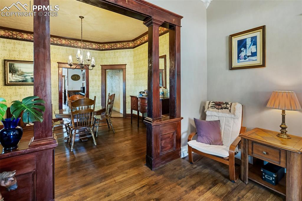 Image 13 of 43: from the west end of the living room, looking over the table you can see th