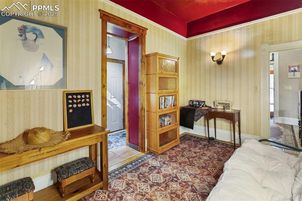 Image 37 of 43: a bedroom, egress through a window in the door to the Foyer, and by the doo