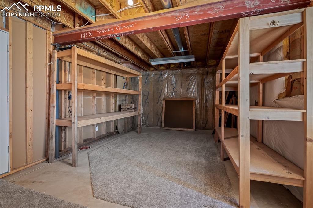 Image 43 of 50: Storage area in Basement with shelving