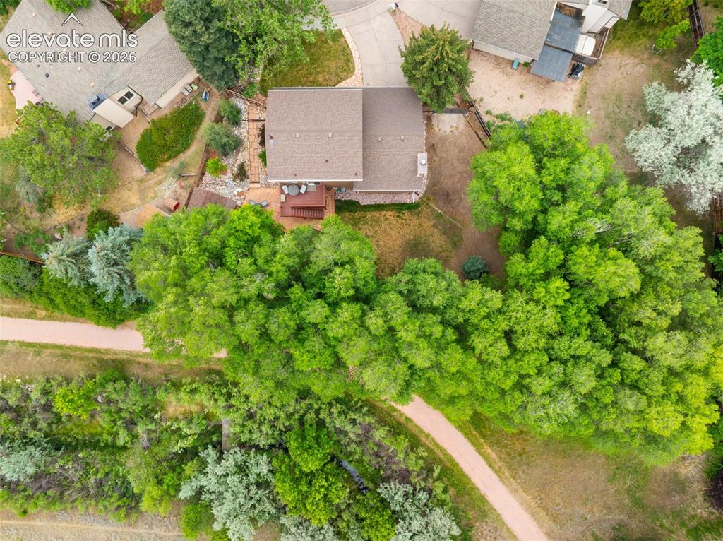 Image 36 of 42: Property featuring a sloped lot and a rear deck