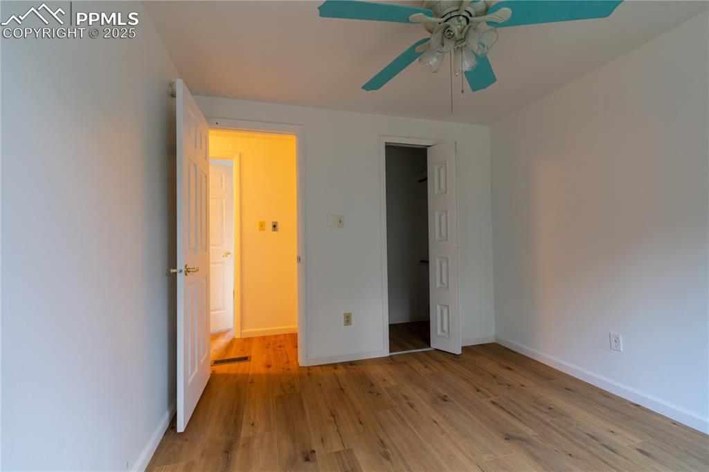 Image 21 of 47: Unfurnished bedroom featuring light wood finished floors and a ceiling fan