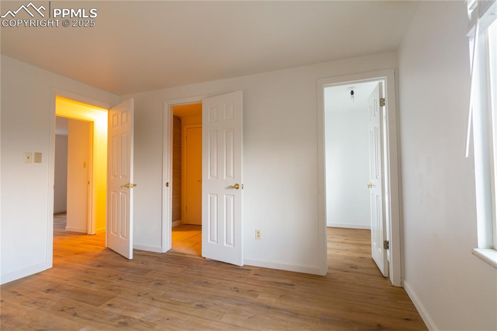 Image 25 of 47: Unfurnished bedroom featuring light wood-style flooring and baseboards