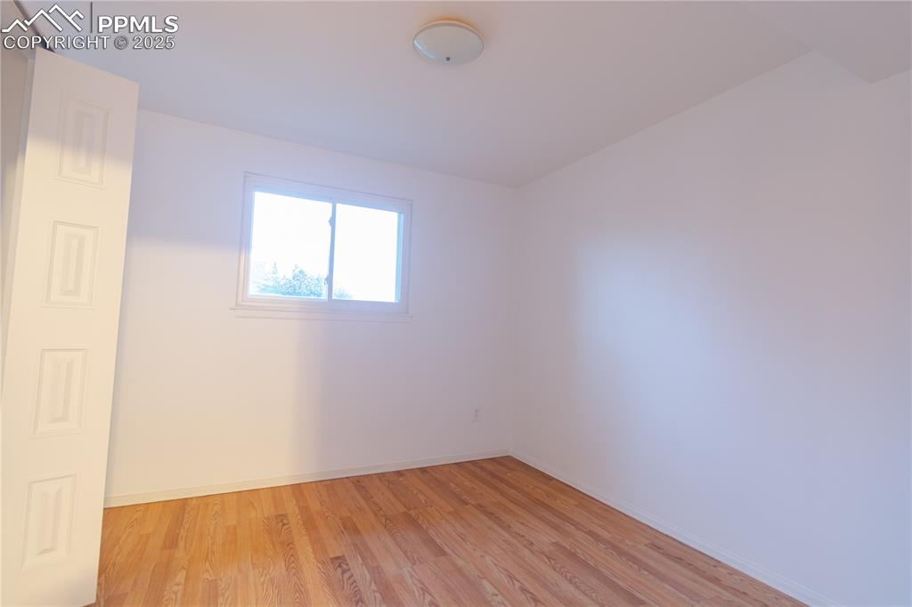Image 37 of 47: Empty room featuring light wood-style flooring