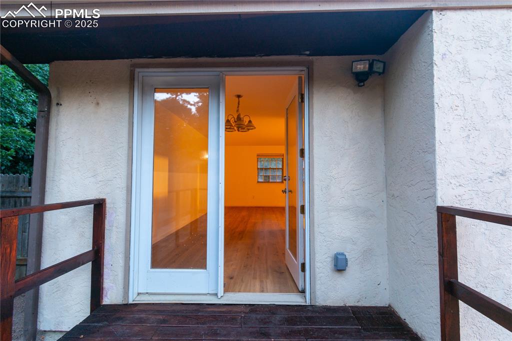 Image 47 of 47: Entrance to property with stucco siding