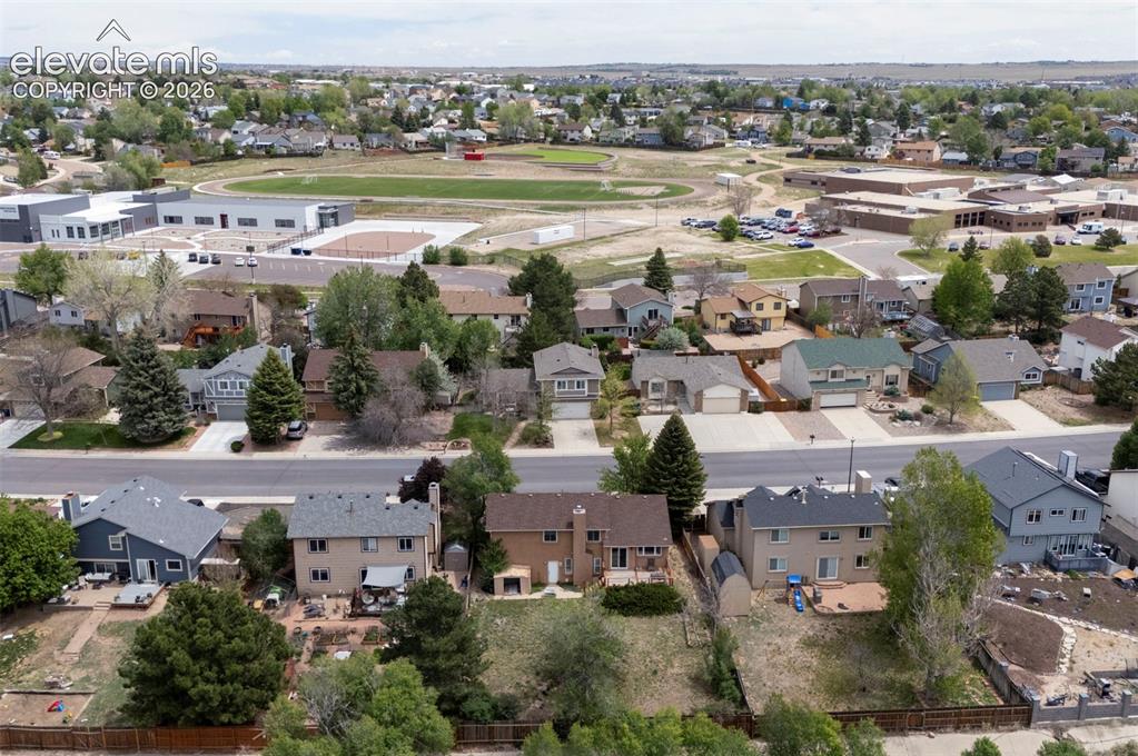 Image 36 of 43: Aerial view showcasing multiple residential properties with varied architec