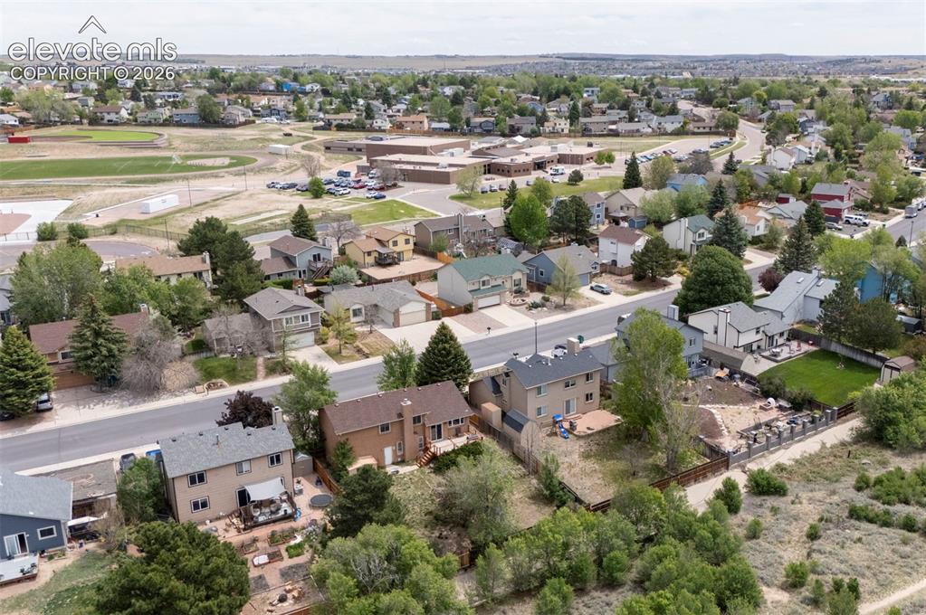 Image 37 of 43: Residential neighborhood featuring a mix of single-family homes, mature tre