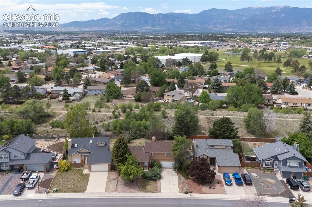 Image 6 of 43: Aerial perspective showcasing a residential area with varied home styles an