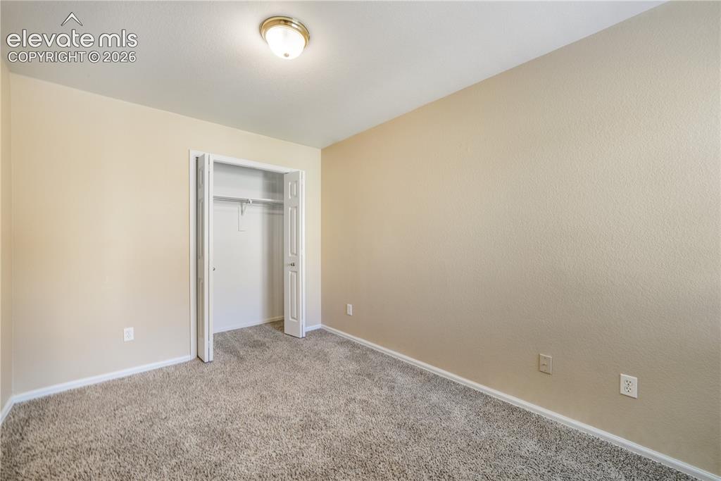 Image 10 of 50: First bedroom, main floor at front of home with connecting access to the 3/