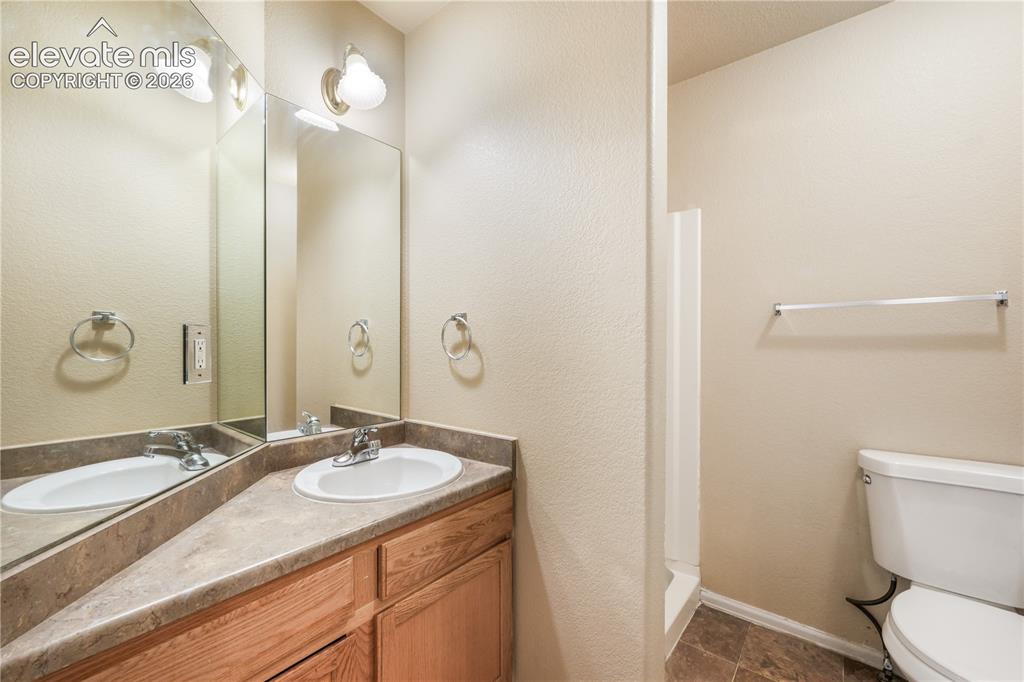 Image 12 of 50: Main level 3/4 bath with access to the front bedroom