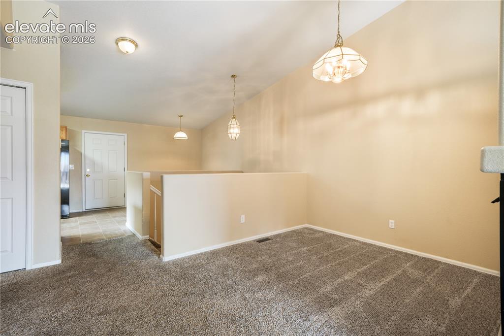 Image 13 of 50: Dining area between kitchen eat in area and living room