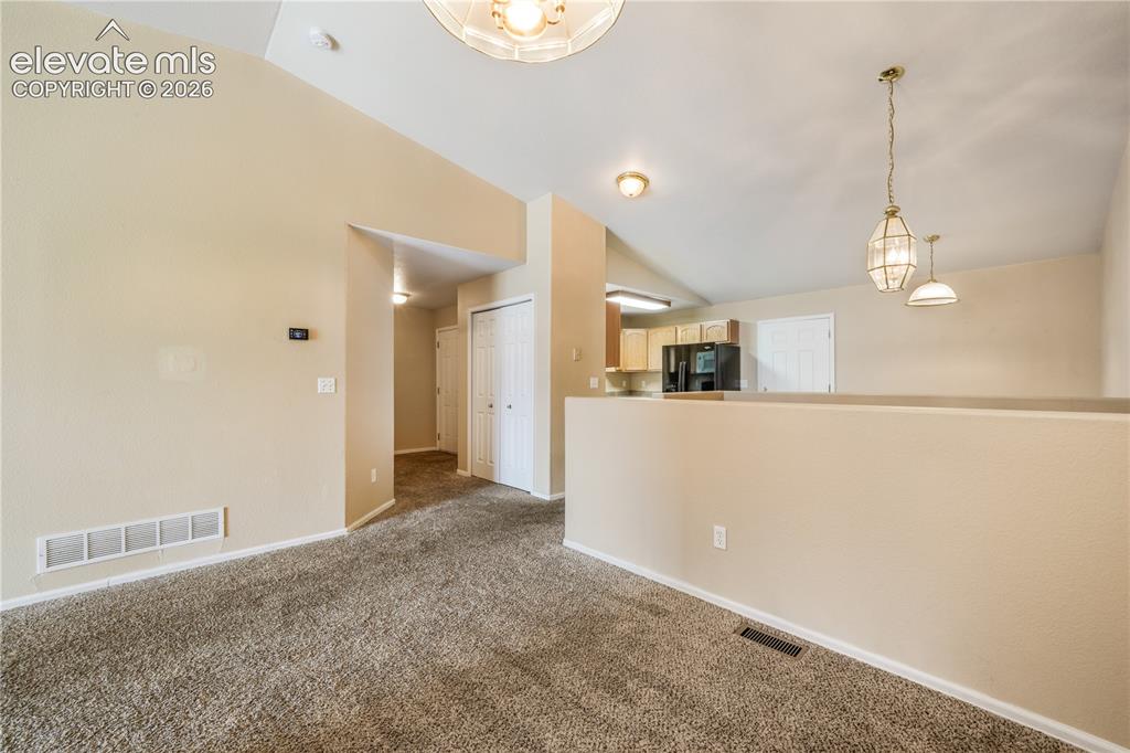Image 14 of 50: Dining area between kitchen eat in area and living room