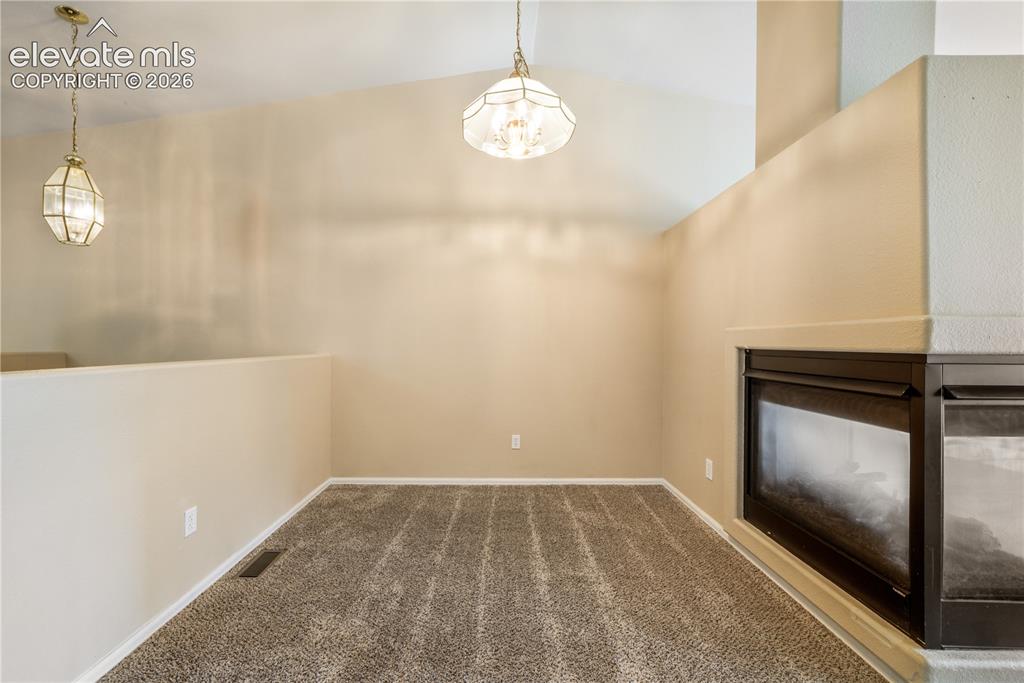 Image 20 of 50: Dining area between kitchen eat in area and living room