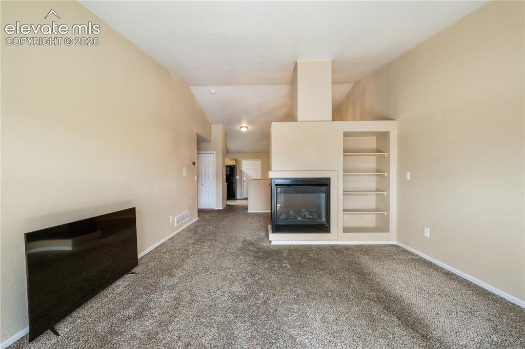 Image 24 of 50: Living room view of gas fireplace