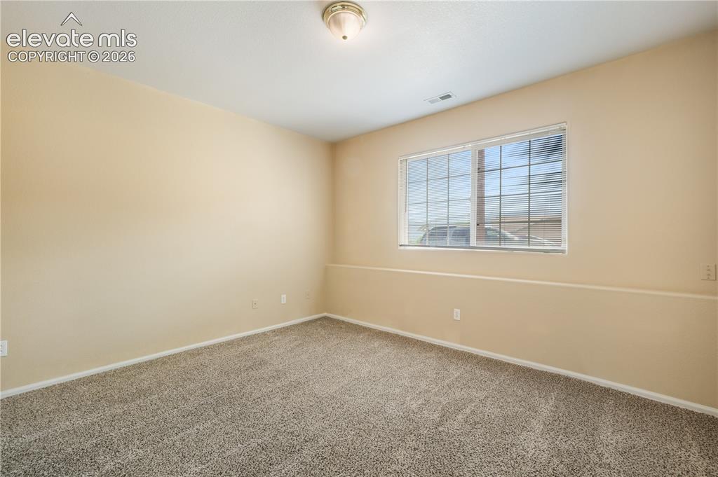 Image 40 of 50: Basement 3rd bedroom