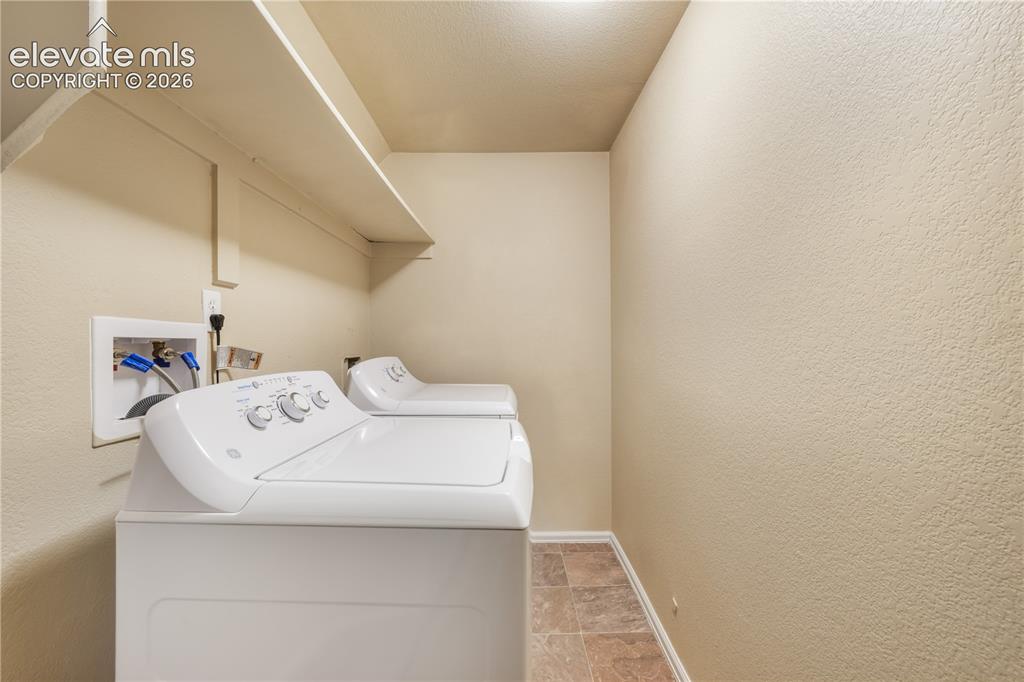 Image 45 of 50: Basement level laundry room