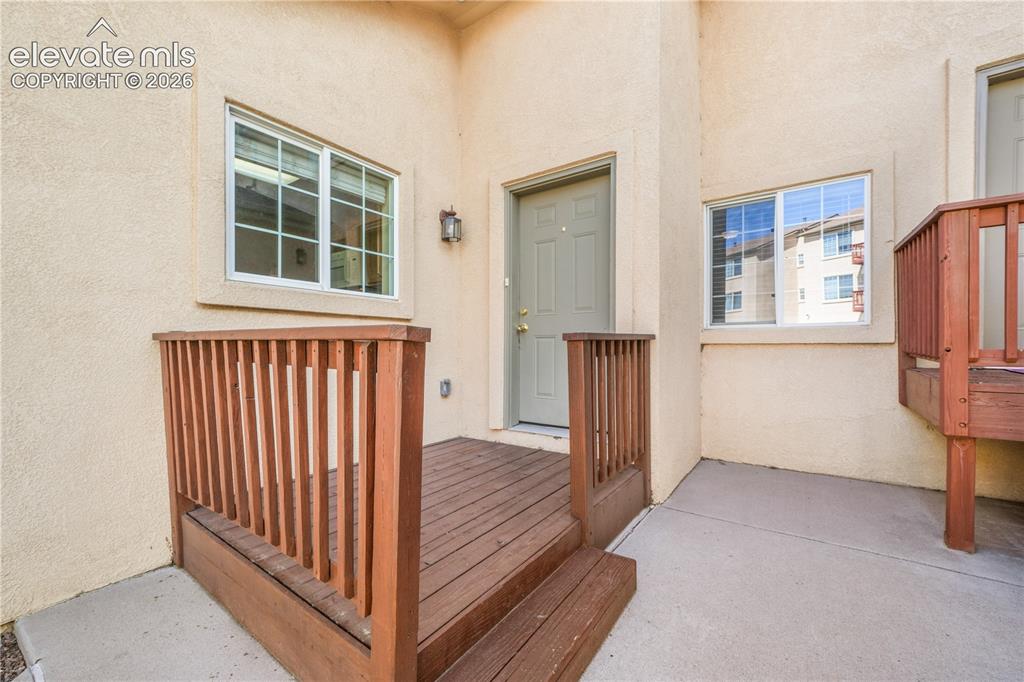 Image 7 of 50: Front entry to home with patio